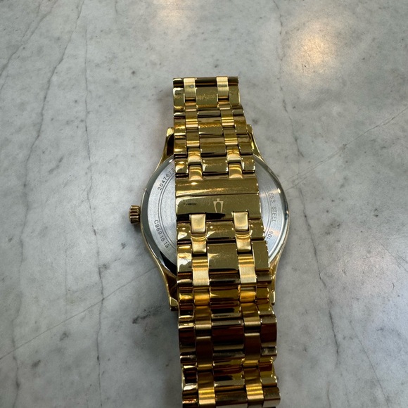 Bulova new 8-diamond black dial, gold-tone stainless steel case and bracelet. - Picture 2 of 4